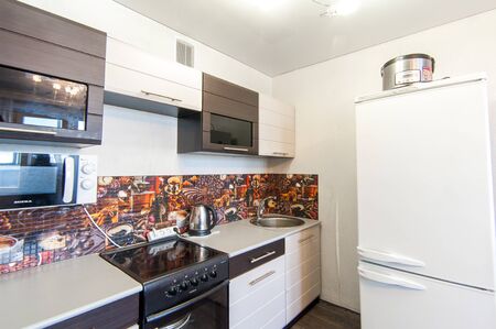 Russia, Moscow- May 12, 2018: interior room apartment. standard repair decoration in hostel. kitchen and dining roomのeditorial素材