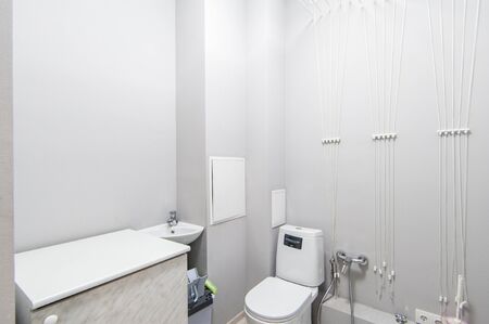 Russia, Moscow- May 20, 2019: interior room apartment. standard repair decoration in hostel. modern bathroom, sink, decoration elements, toilet.のeditorial素材