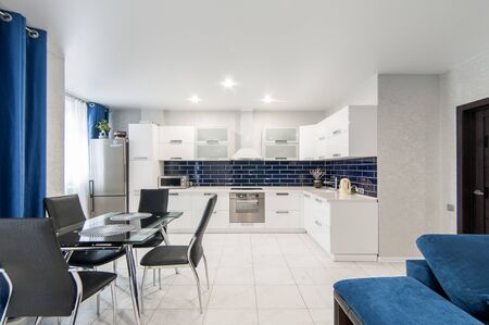 Russia, Moscow- May 21, 2019: interior room apartment. standard repair decoration in hostel. modern kitchen, dining areaのeditorial素材