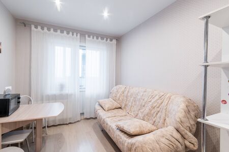 Russia, Moscow- June 11, 2019: interior room apartment. standard repair decoration in hostel. modern kitchen, dining areaのeditorial素材