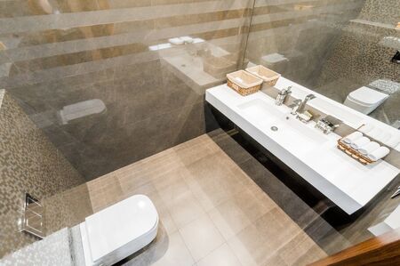 Russia, Moscow- July 21, 2019: interior room apartment. standard repair decoration in hostel. modern bathroom, sink, decoration elements, toiletのeditorial素材