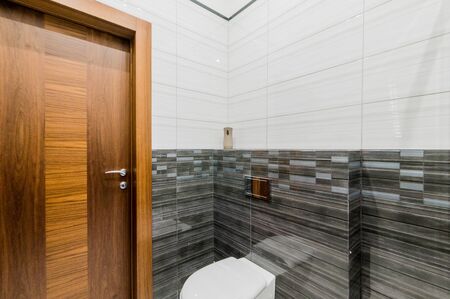 Russia, Moscow- July 21, 2019: interior room apartment. standard repair decoration in hostel. modern bathroom, sink, decoration elements, toiletのeditorial素材