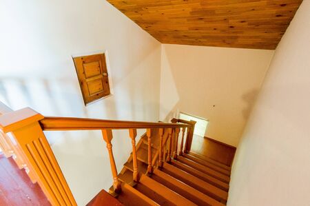 Russia, Omsk- August 02, 2019: interior room apartment. standard repair beautiful designer country house with wooden elements. stairs, stepsのeditorial素材