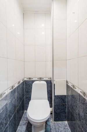 Russia, Omsk- August 02, 2019: interior room apartment. standard repair decoration in hostel. bathroom, sink, decoration elements, toiletのeditorial素材