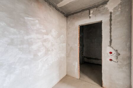 Russia, Omsk- August 05, 2019: interior room apartment. standard repair decoration in hostel. rough repair for self-finishing. interior decoration, bare walls of the room, stage of constructionのeditorial素材