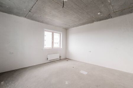 Russia, Moscow- August 05, 2019: interior room apartment rough repair for self-finishing. interior decoration, bare walls of the room, stage of constructionのeditorial素材