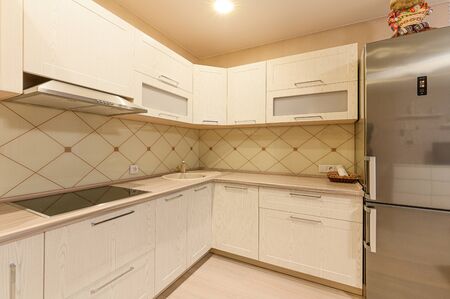 Russia, Moscow- September 10, 2019: interior room apartment modern bright cozy atmosphere. general cleaning, home decoration, preparation of house for sale. modern kitchen, dining areaのeditorial素材