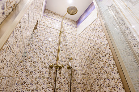Interior of a modern bathroom with ceramic tiles and a shower.の写真素材