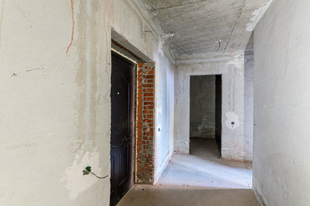 rough repairs for self-finishing. interior decoration, bare walls of the room, stage of construction. interior apartment roomの写真素材