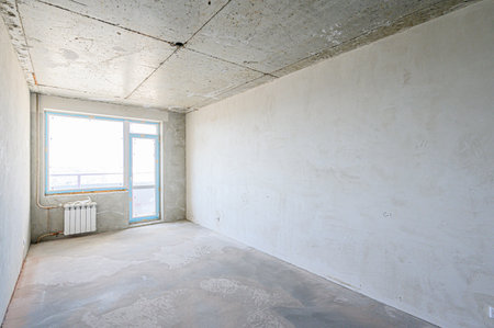 rough repairs for self-finishing. interior decoration, bare walls of the room, stage of construction. interior apartment roomの写真素材