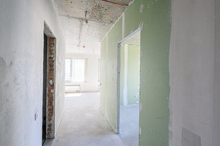 rough repairs for self-finishing. interior decoration, bare walls of the room, stage of construction. interior apartment roomの写真素材