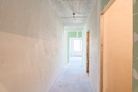 rough repairs for self-finishing. interior decoration, bare walls of the room, stage of construction. interior apartment roomの写真素材