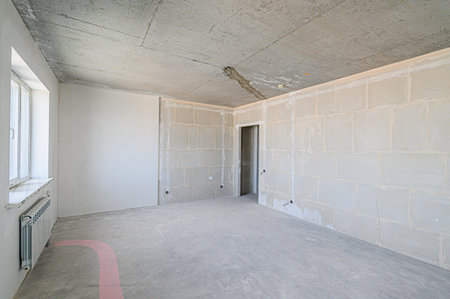 rough repairs for self-finishing. interior decoration, bare walls of the room, stage of construction. interior apartment roomの写真素材