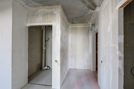 rough repairs for self-finishing. interior decoration, bare walls of the room, stage of construction. interior apartment roomの写真素材