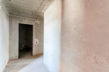 rough repairs for self-finishing. interior decoration, bare walls of the room, stage of construction. interior apartment roomの写真素材