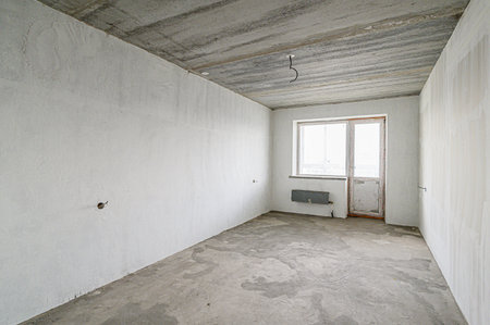 rough repairs for self-finishing. interior decoration, bare walls of the room, stage of construction. interior apartment roomの写真素材