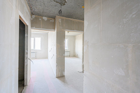 rough repairs for self-finishing. interior decoration, bare walls of the room, stage of construction. interior apartment roomの写真素材