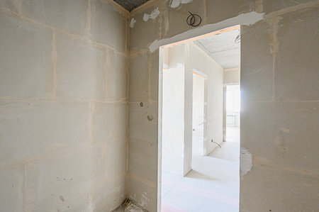 rough repairs for self-finishing. interior decoration, bare walls of the room, stage of construction. interior apartment roomの写真素材