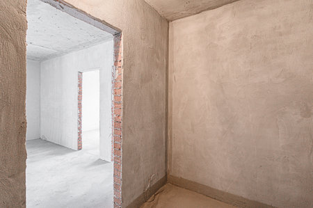 rough repairs for self-finishing. interior decoration, bare walls of the room, stage of construction. interior apartment roomの写真素材