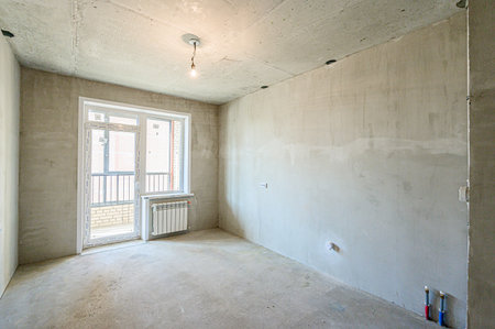 rough repairs for self-finishing. interior decoration, bare walls of the room, stage of construction. interior apartment roomの写真素材