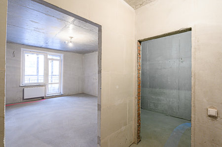 rough repairs for self-finishing. interior decoration, bare walls of the room, stage of construction. interior apartment roomの写真素材