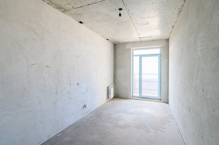 rough repairs for self-finishing. interior decoration, bare walls of the room, stage of construction. interior apartment roomの写真素材