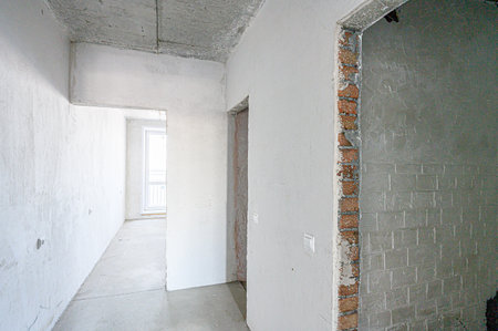 rough repairs for self-finishing. interior decoration, bare walls of the room, stage of construction. interior apartment roomの写真素材
