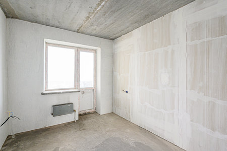 rough repairs for self-finishing. interior decoration, bare walls of the room, stage of construction. interior apartment roomの写真素材