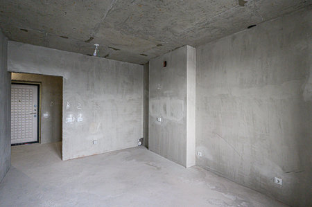 rough repairs for self-finishing. interior decoration, bare walls of the room, stage of construction. interior apartment roomの写真素材