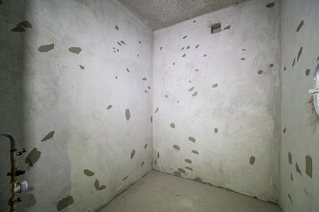 rough repairs for self-finishing. interior decoration, bare walls of the room, stage of construction. interior apartment roomの写真素材