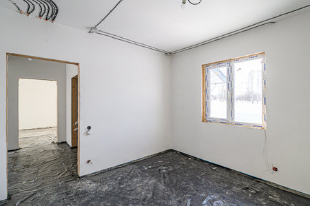 rough repairs for self-finishing. interior decoration, bare walls of the room, stage of construction. interior apartment roomの写真素材