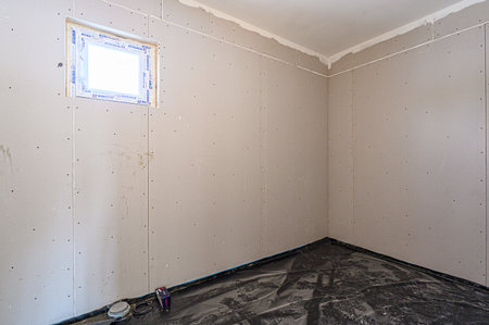 rough repairs for self-finishing. interior decoration, bare walls of the room, stage of construction. interior apartment roomの写真素材