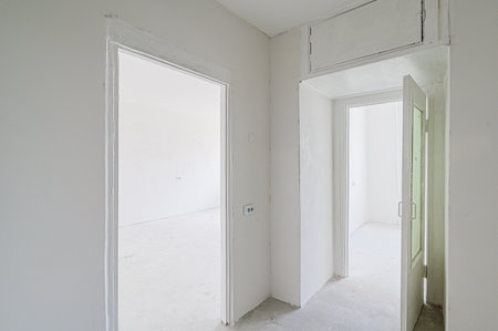 rough repairs for self-finishing. interior decoration, bare walls of the room, stage of construction. interior apartment roomの写真素材