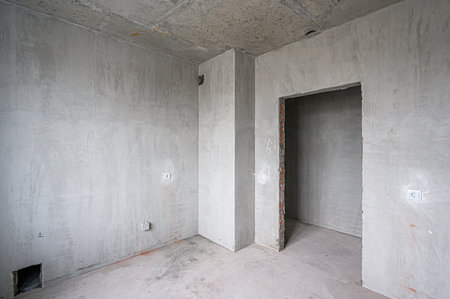 rough repairs for self-finishing. interior decoration, bare walls of the room, stage of construction. interior apartment roomの写真素材