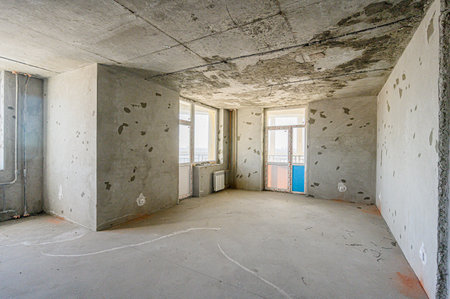 rough repairs for self-finishing. interior decoration, bare walls of the room, stage of construction. interior apartment roomの写真素材