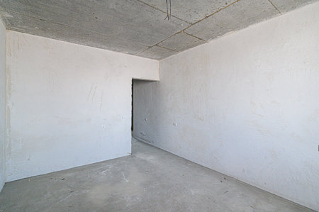 rough repairs for self-finishing. interior decoration, bare walls of the room, stage of construction. interior apartment roomの写真素材