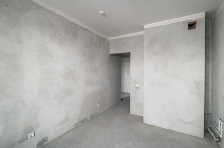 rough repairs for self-finishing. interior decoration, bare walls of the room, stage of construction. interior apartment roomの写真素材
