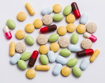 different colored pills in the pack closeupの写真素材