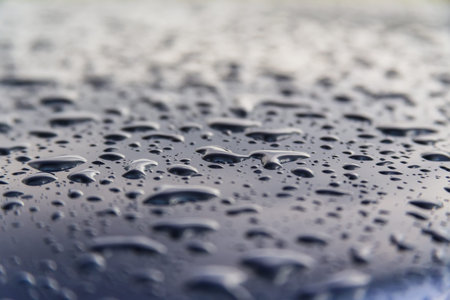drops of water on the car after rainの写真素材