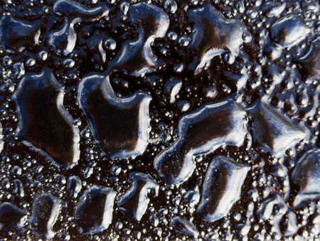 Drops of fatty drops on black