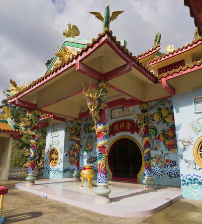 A beautiful view of the temple of the temple of the Goddess of Mercy. The only Chinese temple on the island in Chaloklum, Koh Phangan, Thailand. Show the decorative orange roof of the main pagoda and the surrounding jungle, july 1, 2017のeditorial素材