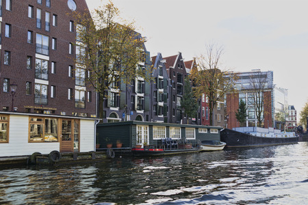 Netherlands, Holland, Amsterdam, November 3, 2015, the way through the Amsterdam channels. Architecture and boats in which people live.のeditorial素材