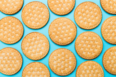 cookies with Saar on a blue background in a checkerboard pattern