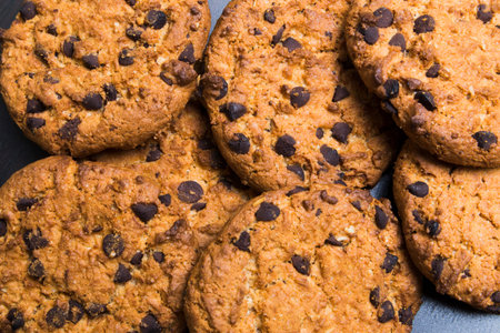 chocolate chip cookies together on each otherの写真素材