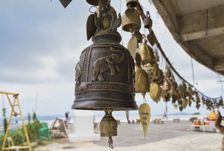 Thailand, Phuket, April 20, 2015, bells to scare away evil spirits and Buddhism in Thailandの写真素材