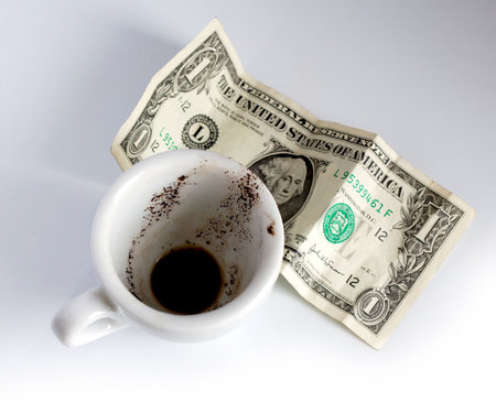 empty coffee cup and dollar の写真素材