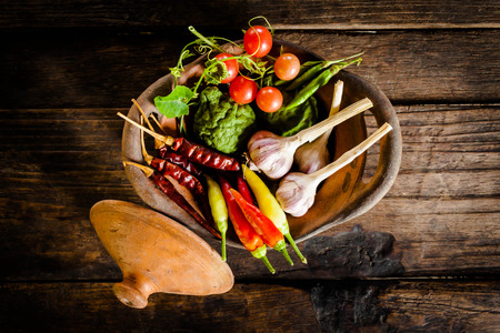 Condiments and spices for creative cooking on dark rustic wooden background .の写真素材