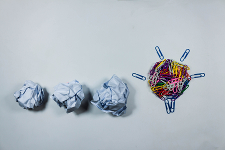 idea concept with crumpled  paper and light bulb on white background.の写真素材