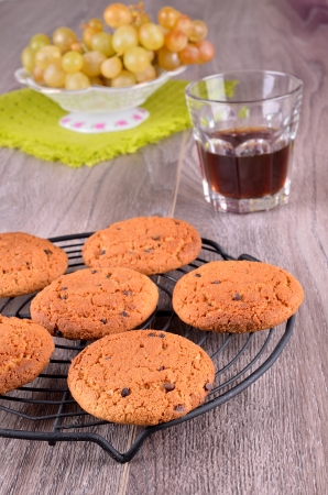 Biscuits with chocolate drops on a wooden backgroundの写真素材
