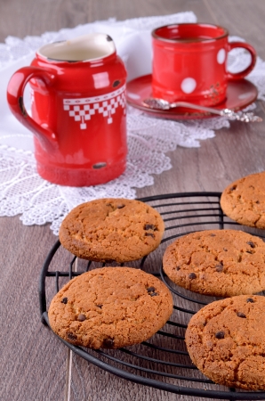 Biscuits with chocolate drops on a wooden backgroundの写真素材